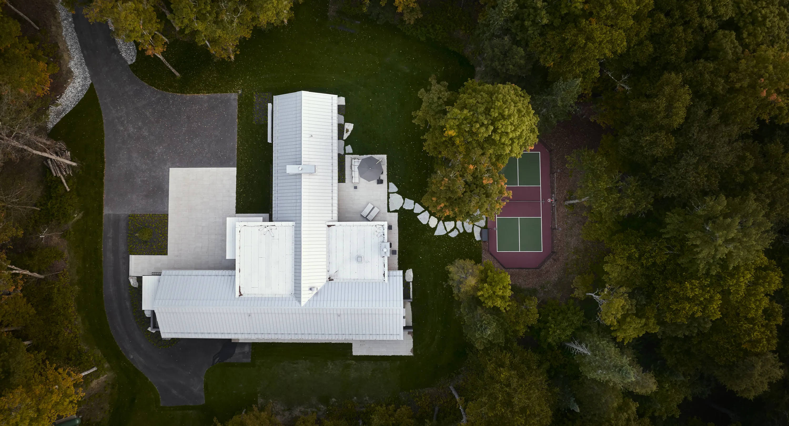 Aerial shot capturing the residence blanketed in snow